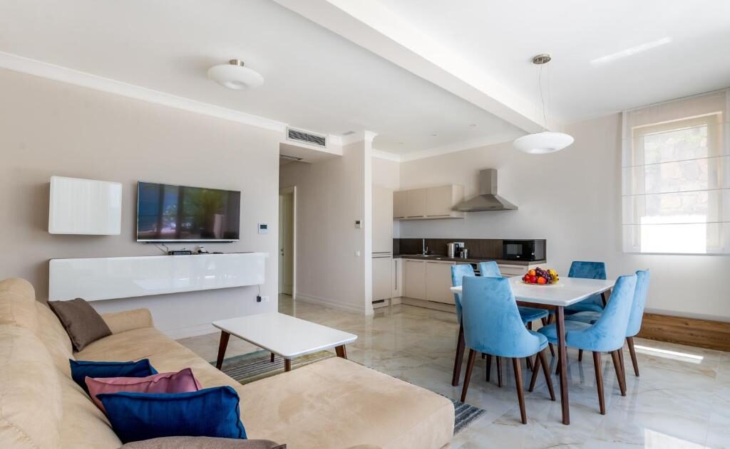 Bright living and dining area inside a Boka di Mare apartment