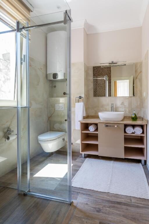 Modern private bathroom with walk-in shower